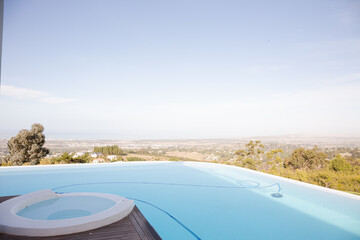 Fototapeta na wymiar Infinity pool overlooking hillside