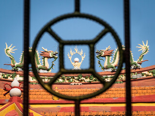 framing the roof design of buddhist temple using outdoor fence 