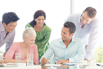 Business people smiling in meeting