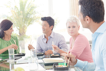 Business people smiling in lunch meeting