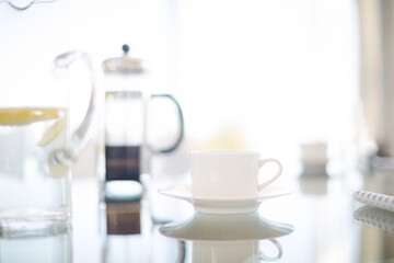 Coffee cups and water glasses on meeting table