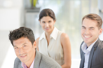 Business people smiling on sofa