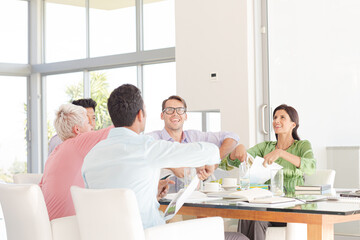 Business people cheering in meeting