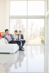 Business people talking on sofa in office