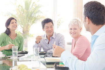 Business people smiling in lunch meeting