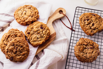 Homemade Oatmeal cookie on a wooden board and cooling rack