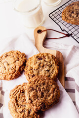 Homemade Oatmeal cookie on a wooden board and cooling rack