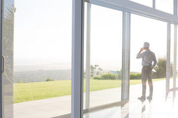 Businessman talking on cell phone outdoors