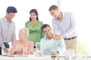 Business people smiling in meeting