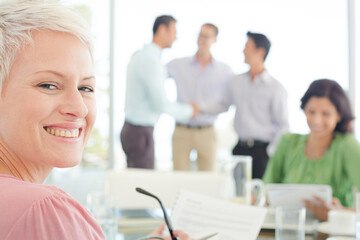 Businesswoman smiling in meeting