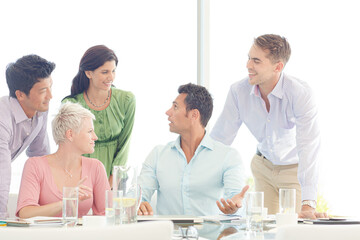 Business people smiling in meeting