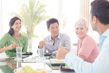 Business people smiling in lunch meeting