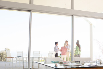 Business people talking outside office