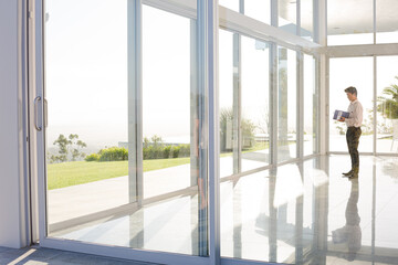 Businessman standing at office window