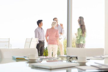Business people talking outside office