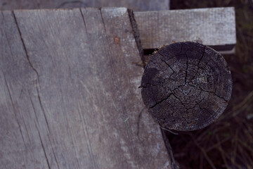 Old grey wooden bridge with close up. Weathered wood outdoors background.