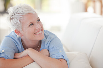 Woman lying on sofa