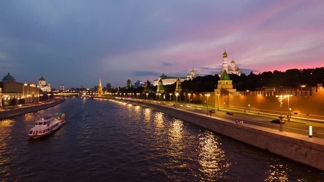 Urban landscape time lapse of Kremlin and Moscow river with ships at sunset. . High quality 4k footage