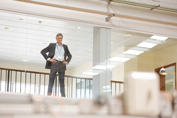 Businessman looking out glass window