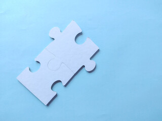 Puzzle piece on blue . Business solutions, success and strategy.