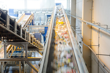 Recycled material on conveyor belt in recycling center