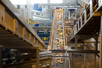 Recycled material on conveyor belt in recycling center