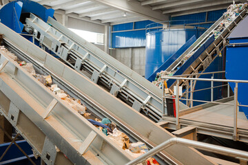 Recycled material on conveyor belt in recycling center