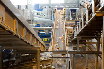 Recycled material on conveyor belt in recycling center