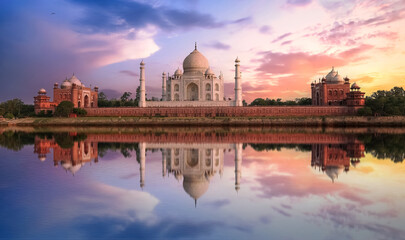 Taj Mahal sunset view from Mehtab Bagh on the banks of Yamuna river. Taj Mahal is a white marble mausoleum designated as a UNESCO World heritage site at Agra, India.