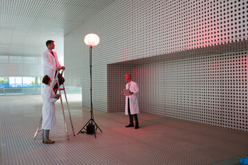 Obraz na płótnie Canvas Scientists testing llamp in modern building