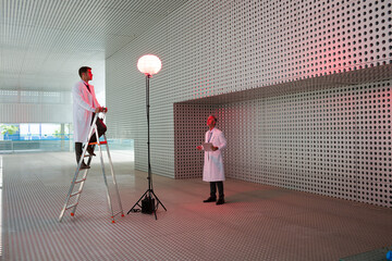 Scientists testing llamp in modern building