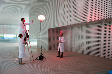 Scientists testing llamp in modern building