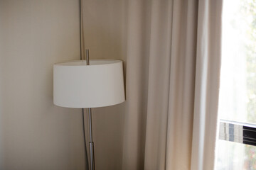 Lamp standing in corner of room