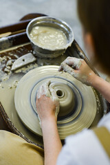 Obraz premium making pottery of different shape on pottery wheel