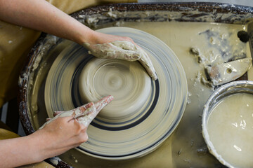 making pottery of different shape on pottery wheel