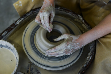 making pottery of different shape on pottery wheel