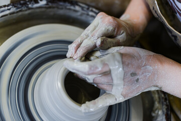 making pottery of different shape on pottery wheel