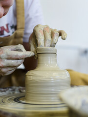 making pottery of different shape on pottery wheel