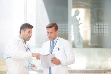 Scientists talking in laboratory