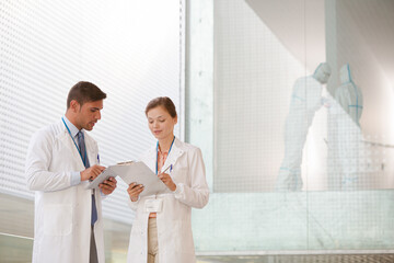 Doctors talking in hospital corridor