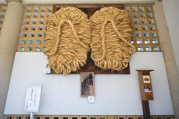 Giant rope sandals in exhibition at buddhist temple, Kamakura, Japan