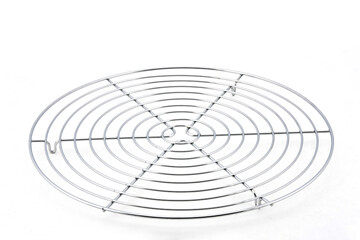 Round stainless steel grid grill isolated on white background