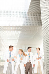 Doctors walking in hospital corridor