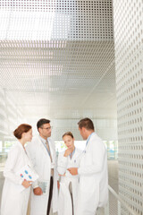 Doctors talking in hospital corridor
