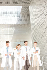 Doctors walking in hospital corridor