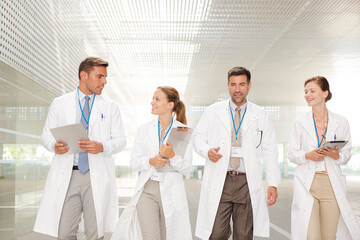Fototapeta premium Doctors walking in hospital corridor