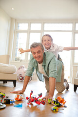 Father and son playing with toys