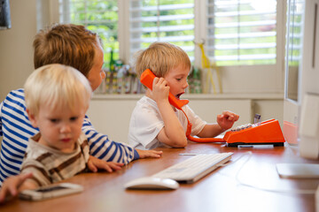 Boys working in home office