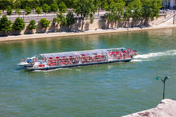 A pleasure boat on the Seine River. Paris, France