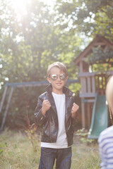 Boy gesturing outdoors